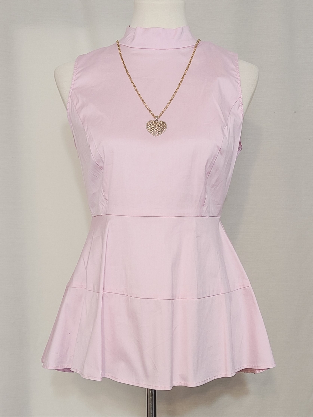 Pink High Neckline Peplum Sleeveless Top
